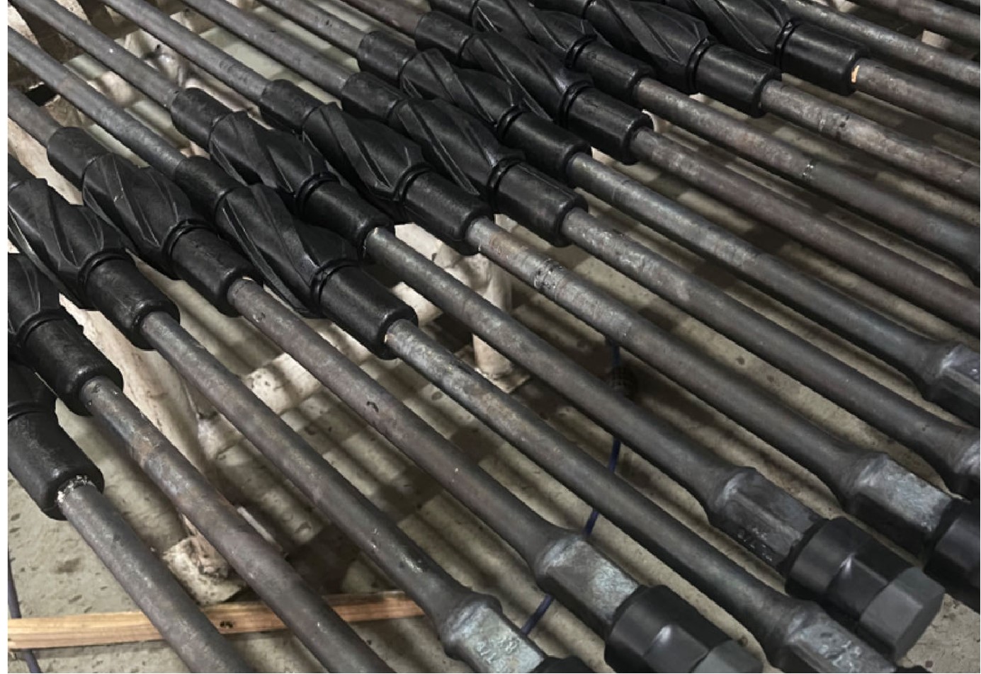 Guide and wax scraping sucker rods